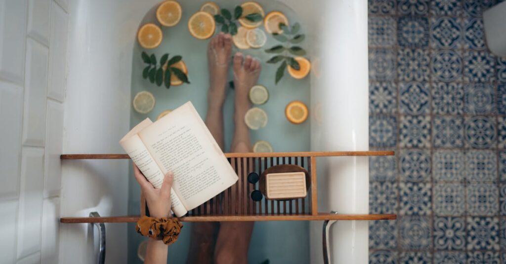 A tranquil bathtub with citrus fruits, book, and self-care essentials for relaxation.